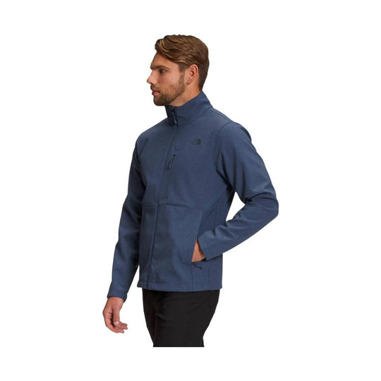 Blue zip-up fleece jacket with stand collar and chest pocket, shown in side view