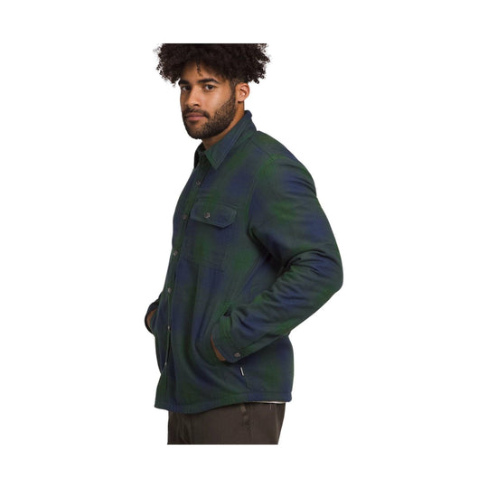 Dark plaid button-up shirt jacket with chest flap pockets, shown in side view.