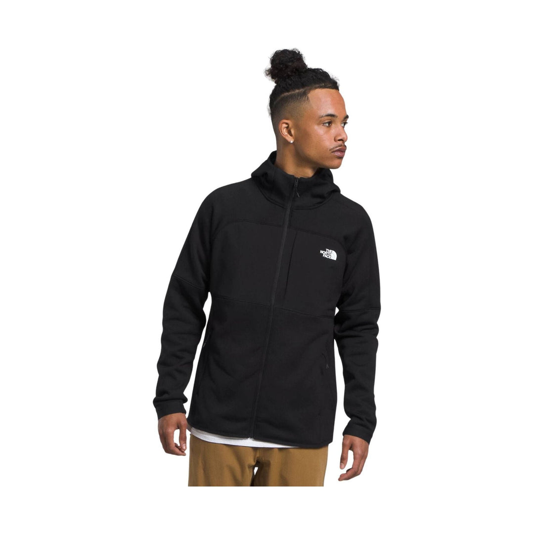 Black zip-up fleece jacket with a stand collar and small chest logo