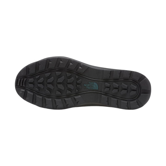 Black boot outsole with deep tread and The North Face logo