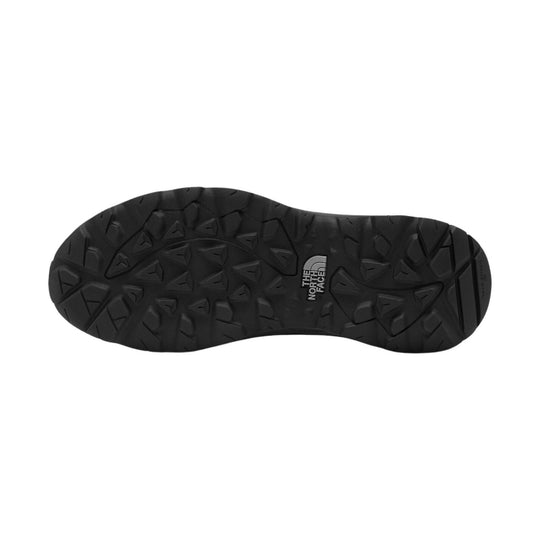 Black boot outsole with rugged tread and The North Face logo