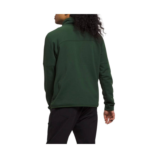 Dark green half-zip jacket shown from the back on a model