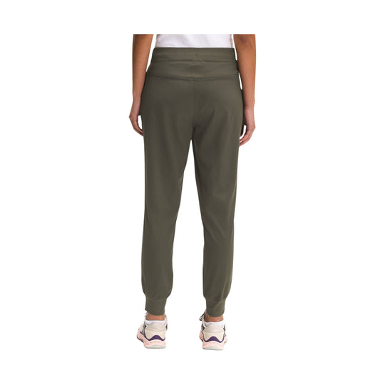 Olive green jogger pants shown from the back, with tapered legs and cuffed ankles
