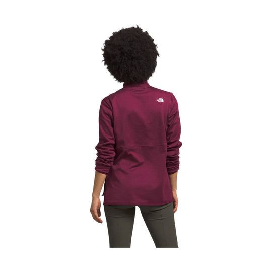 Maroon long-sleeve pullover tunic with small white logo on the upper back, shown from behind