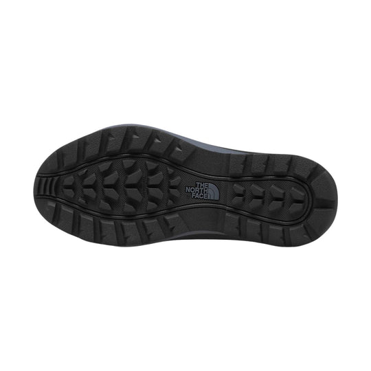 Black winter boot outsole with deep tread and The North Face logo