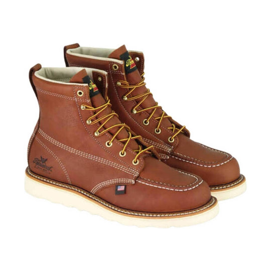 Brown leather lace-up work boots with moc toe and light-colored soles