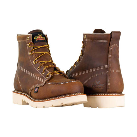 Brown leather lace-up work boots with white soles, shown from the front and back