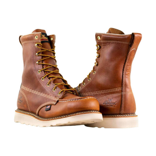Brown leather lace-up work boots with yellow laces and white soles, shown from the side and back