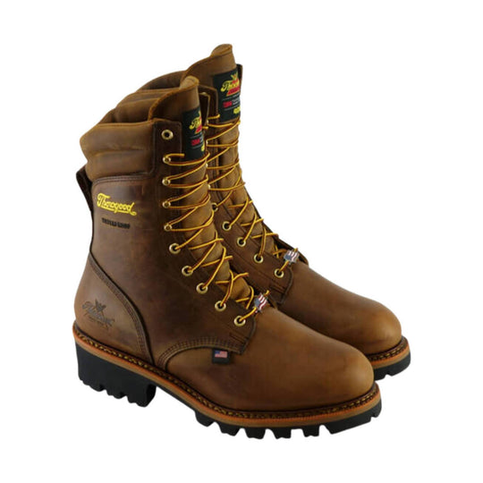 Brown leather insulated lace-up work boots with black lug soles and visible Thorogood branding