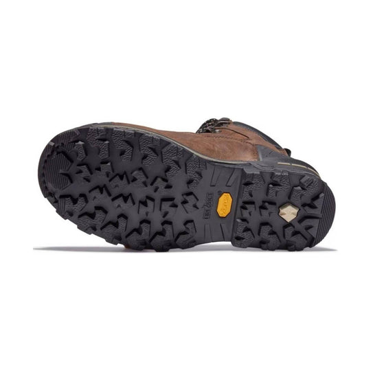 Brown leather work boot shown from the outsole, with deep black lug tread and a yellow sole insert.