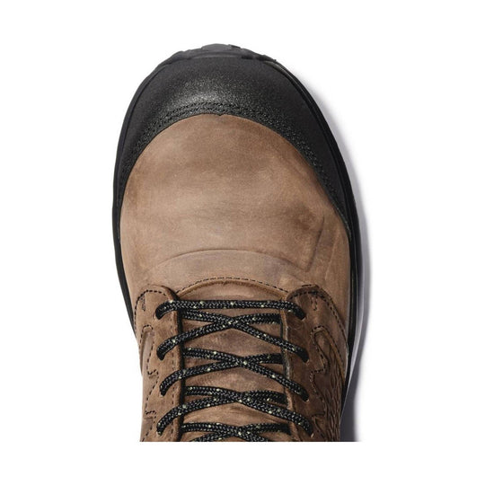 Brown and black work boot with a protective toe cap and black laces, top view