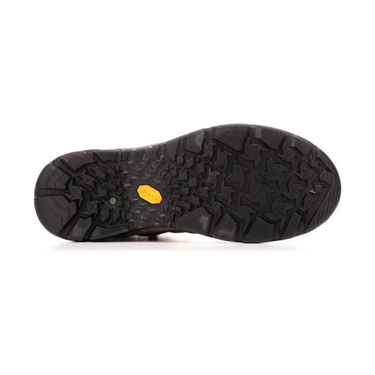 Black lugged boot outsole with a yellow Vibram badge