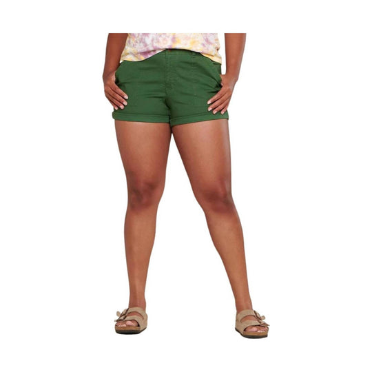 Green cuffed camp shorts with front pockets and rolled hems, shown on a model