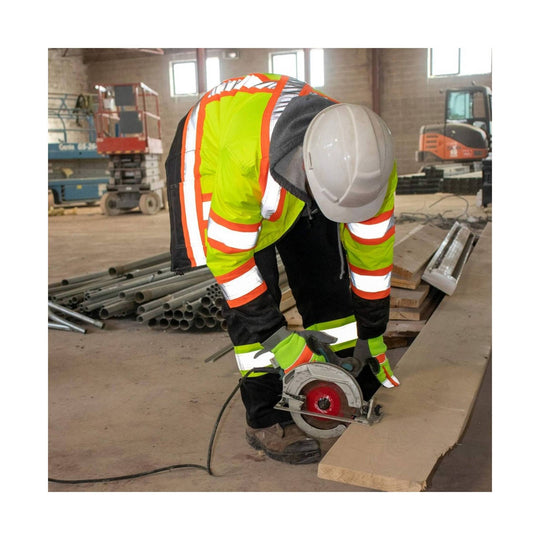 High-visibility insulated safety jacket with reflective striping and hooded worker using a circular saw