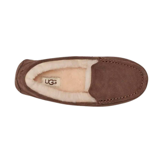 Brown suede moccasin slipper with cream shearling lining and UGG logo on the insole