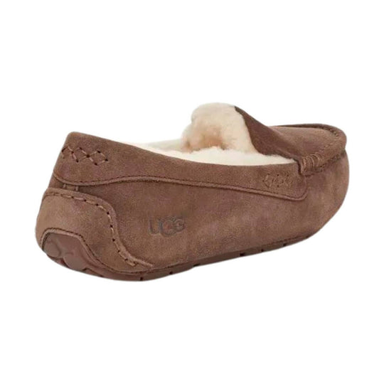 Brown suede moccasin slipper with cream shearling lining and stitched seams, side view