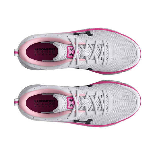 White athletic sneakers with pink trim, mesh uppers, and visible branding on the insoles