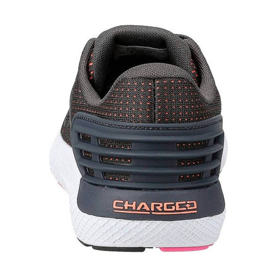 Black mesh athletic shoe with white midsole and pink heel accent, rear view