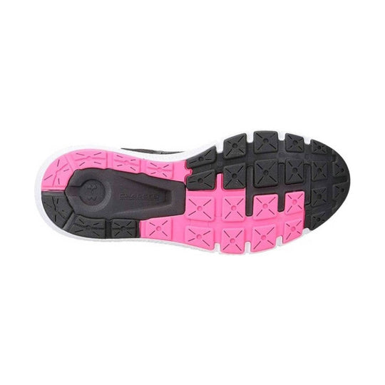 Black and pink athletic shoe outsole with segmented tread pattern