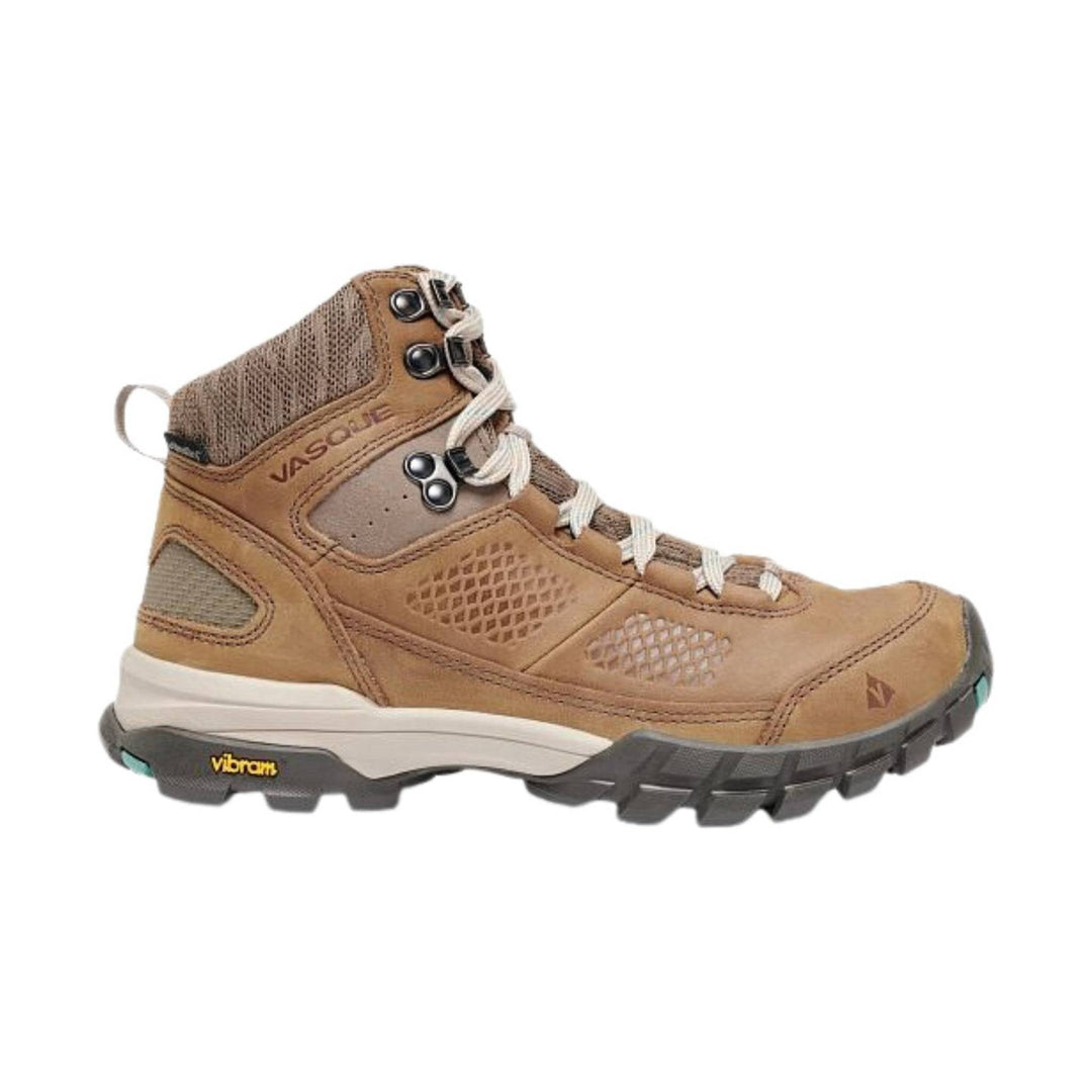 Tan and brown mid-height hiking boot with white laces and black Vibram sole
