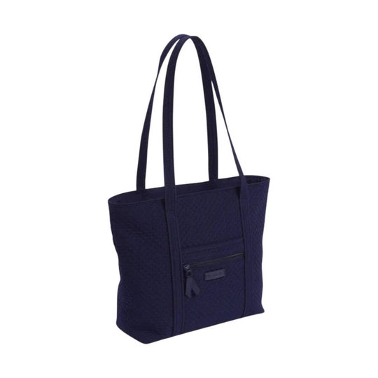 Navy quilted tote bag with long shoulder straps and a front zip pocket