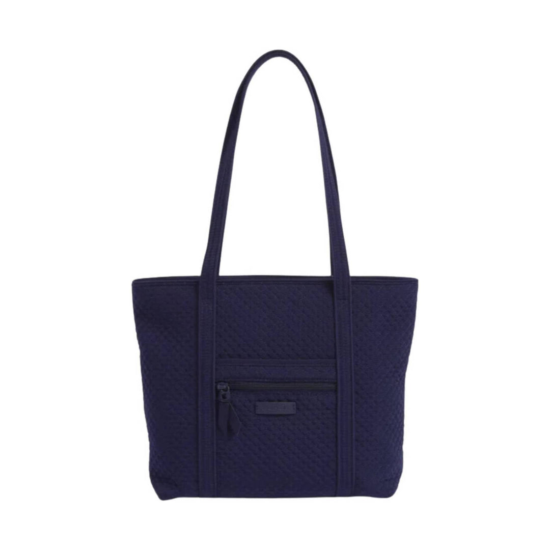 Dark navy quilted tote bag with long shoulder straps and a small front zip pocket