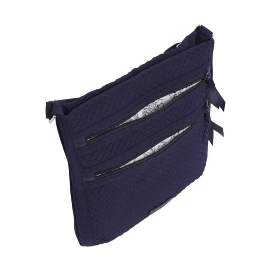 Dark navy quilted crossbody bag with three front zip pockets