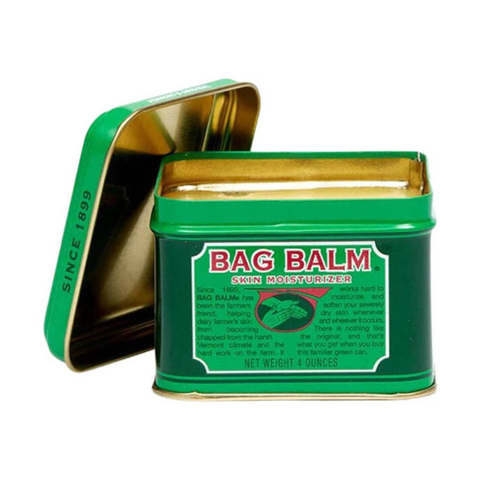 Green metal tin of skin moisturizer with lid open