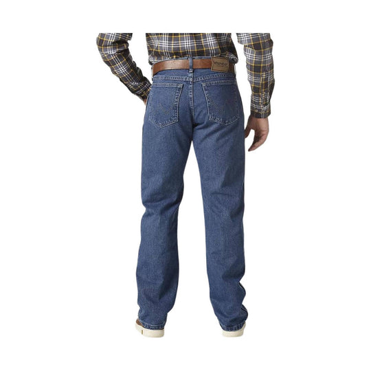 Back view of blue straight-leg jeans with five-pocket styling and a brown leather Wrangler patch on the waistband
