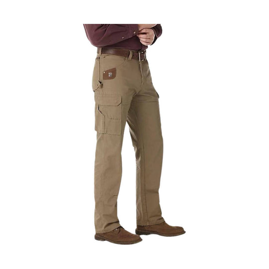 Tan cargo pants with multiple pockets, worn with a brown belt and brown shoes