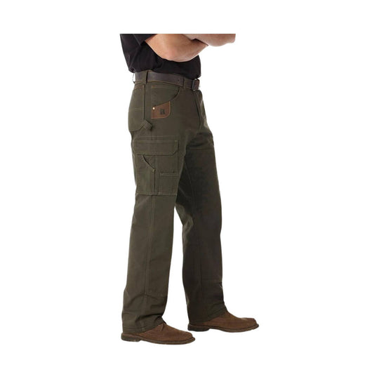 Olive cargo pants shown in side view with multiple pockets and brown shoes