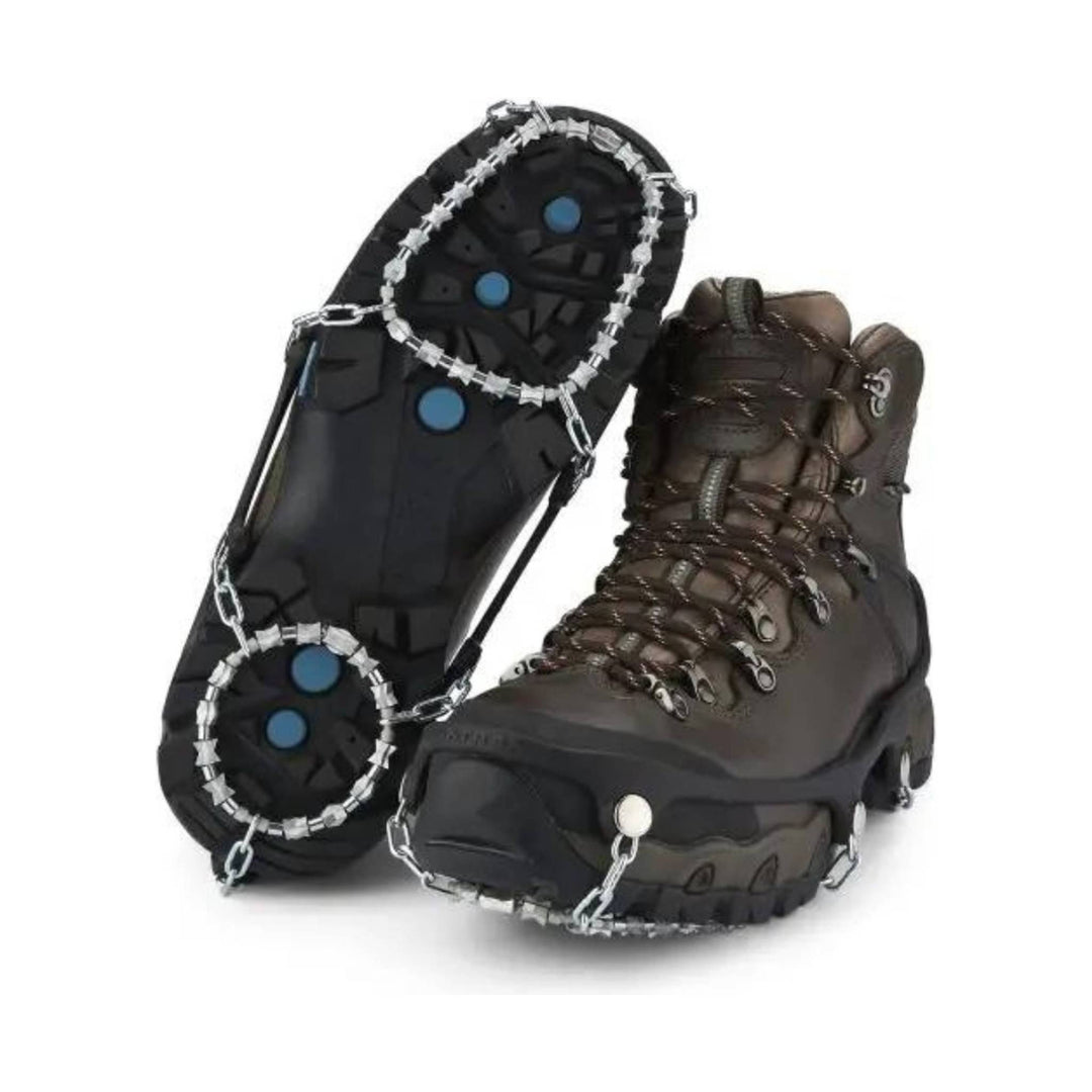 Pair of brown winter boots with traction cleats attached to the soles