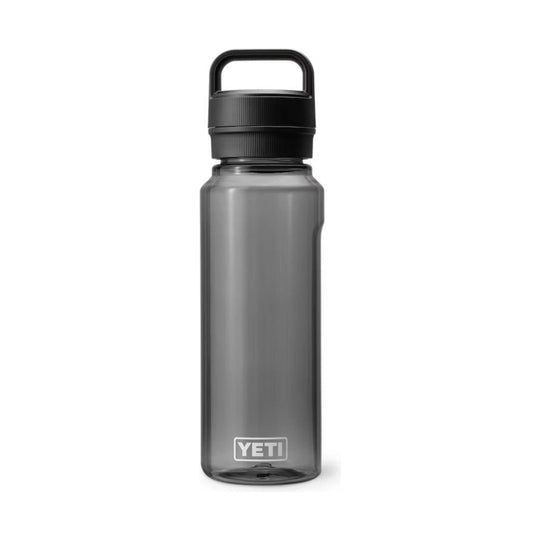 Smoke-gray reusable water bottle with a black carry-handle cap